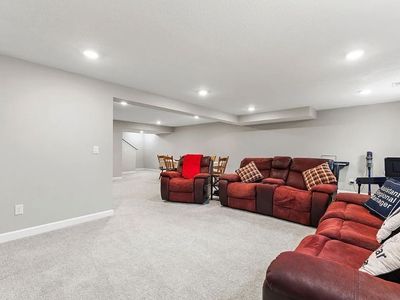 Red Reclining Sofa and Loveseat Set - Comfortably Used Condition
