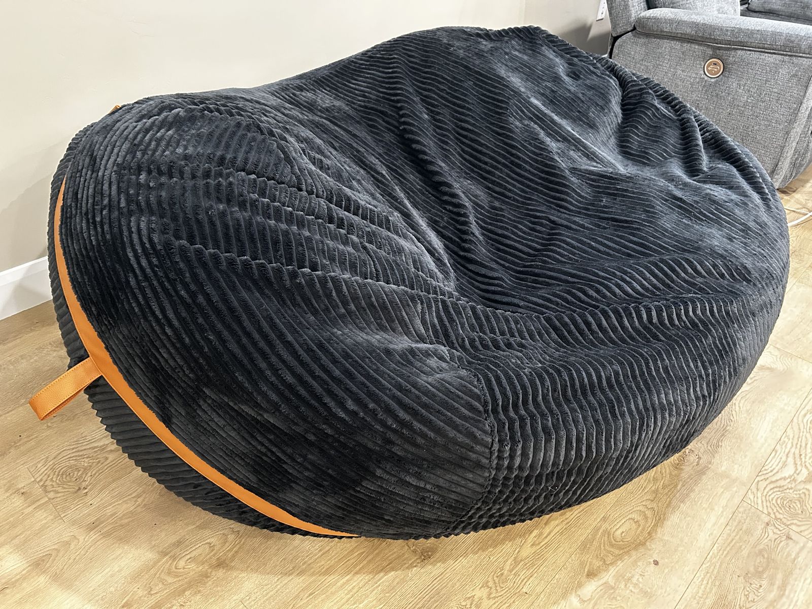 7 ft Black Bean Bag with brown leather straps. 3 months old.