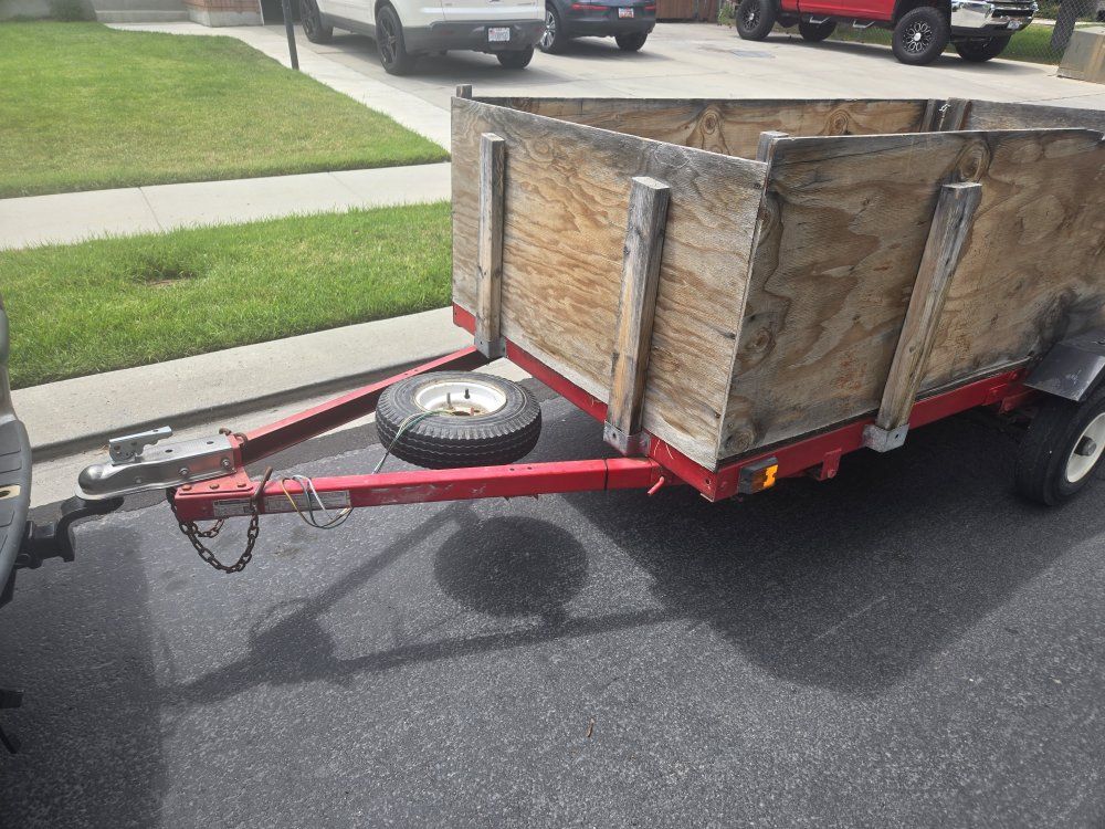Utility Trailer with Wood Sides and Spare Tire - Versatile Hauling Solution