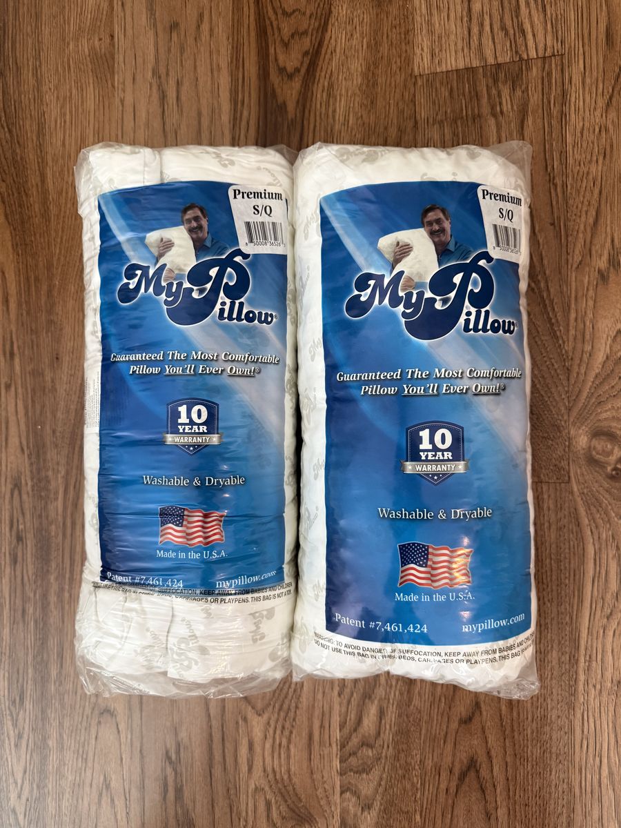 Two new queen premium MyPillows medium firmness - never out of bag.