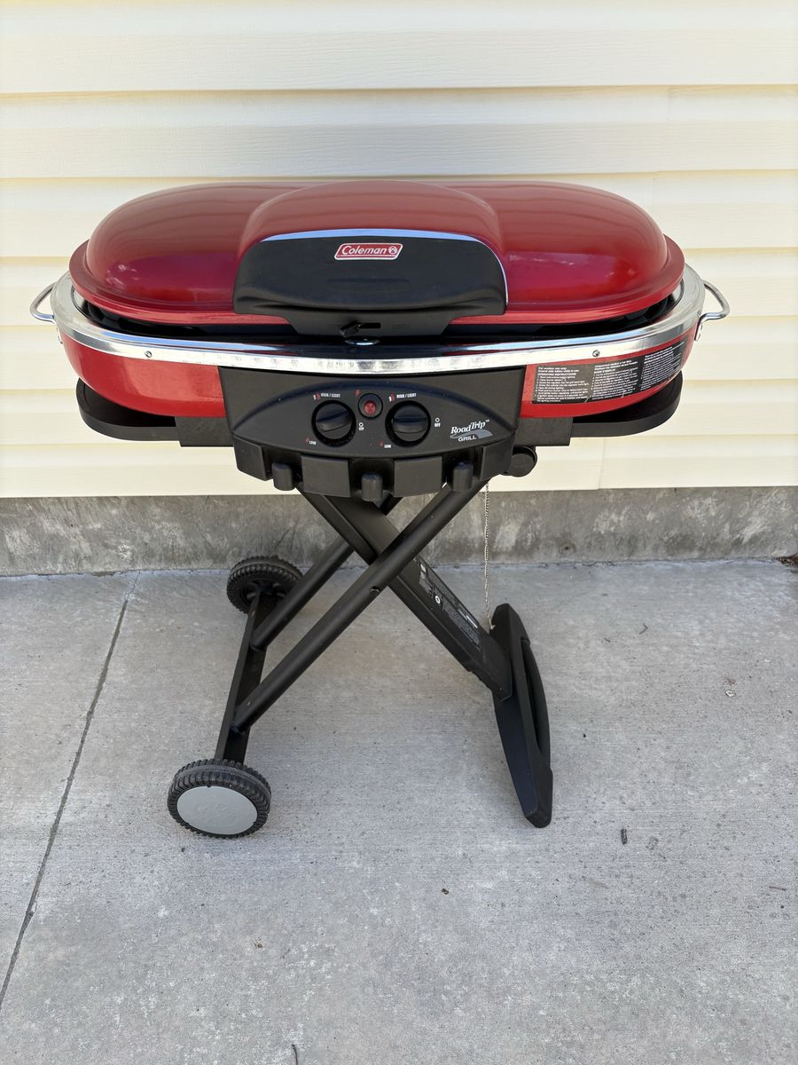 Coleman Roadtrip model portable propane grill.
