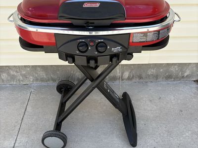 Coleman Roadtrip model portable propane grill.