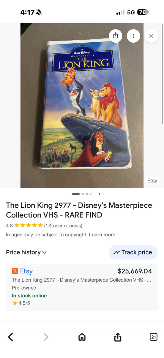 Two Randall Allen leather chairs and ottomans.