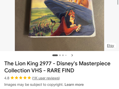 Two Randall Allen leather chairs and ottomans.