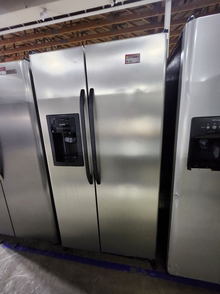 GE Stainless Steel Side-by-Side Refrigerator with a Full Warranty!