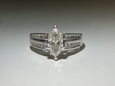 Elegant Marquise Cut Diamond Engagement Ring with Channel Set Accents - Sterling Silver