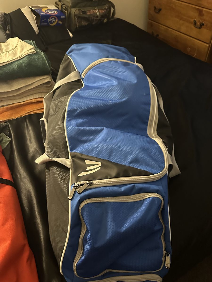 Baseball gear football soccer And a baseball an electric pump and a baseball helmet left-handed baseball glove
