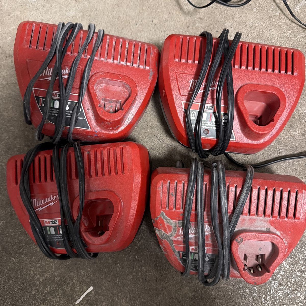 Four Milwaukee M2 chargers