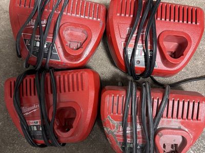 Four Milwaukee M2 chargers