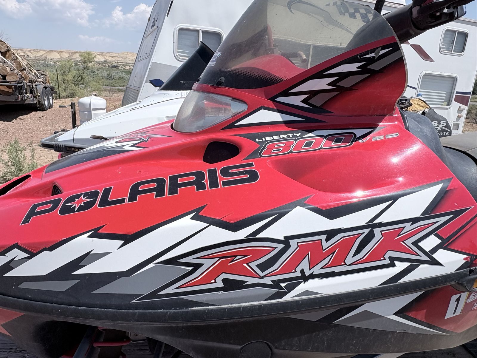 Two Polaris Snowmobiles with Trailer - Titles Included