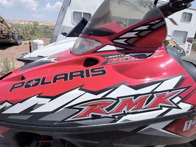 Two Polaris Snowmobiles with Trailer - Titles Included
