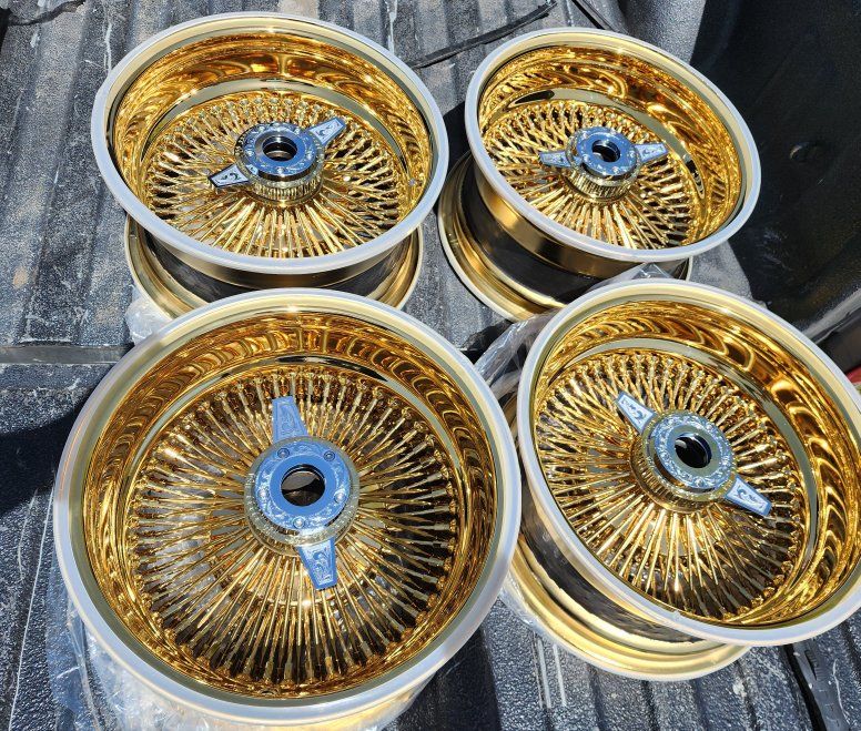 Set of Gold Wire Wheels with engraved knockoffs and Locking adapters brand new 14s