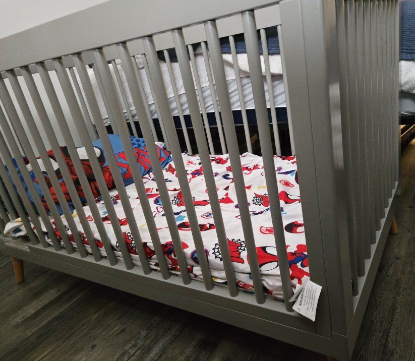 grey crib