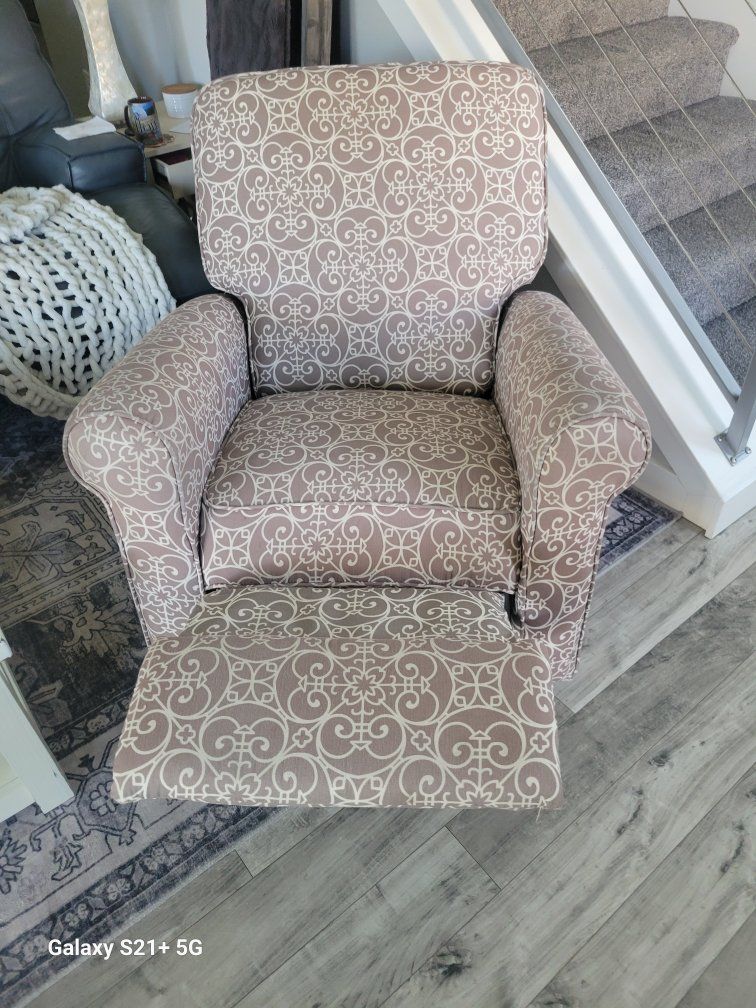 Gray patterned reclining/rocking accent chair.