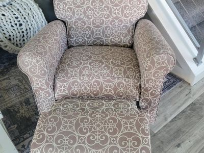 Gray patterned reclining/rocking accent chair.