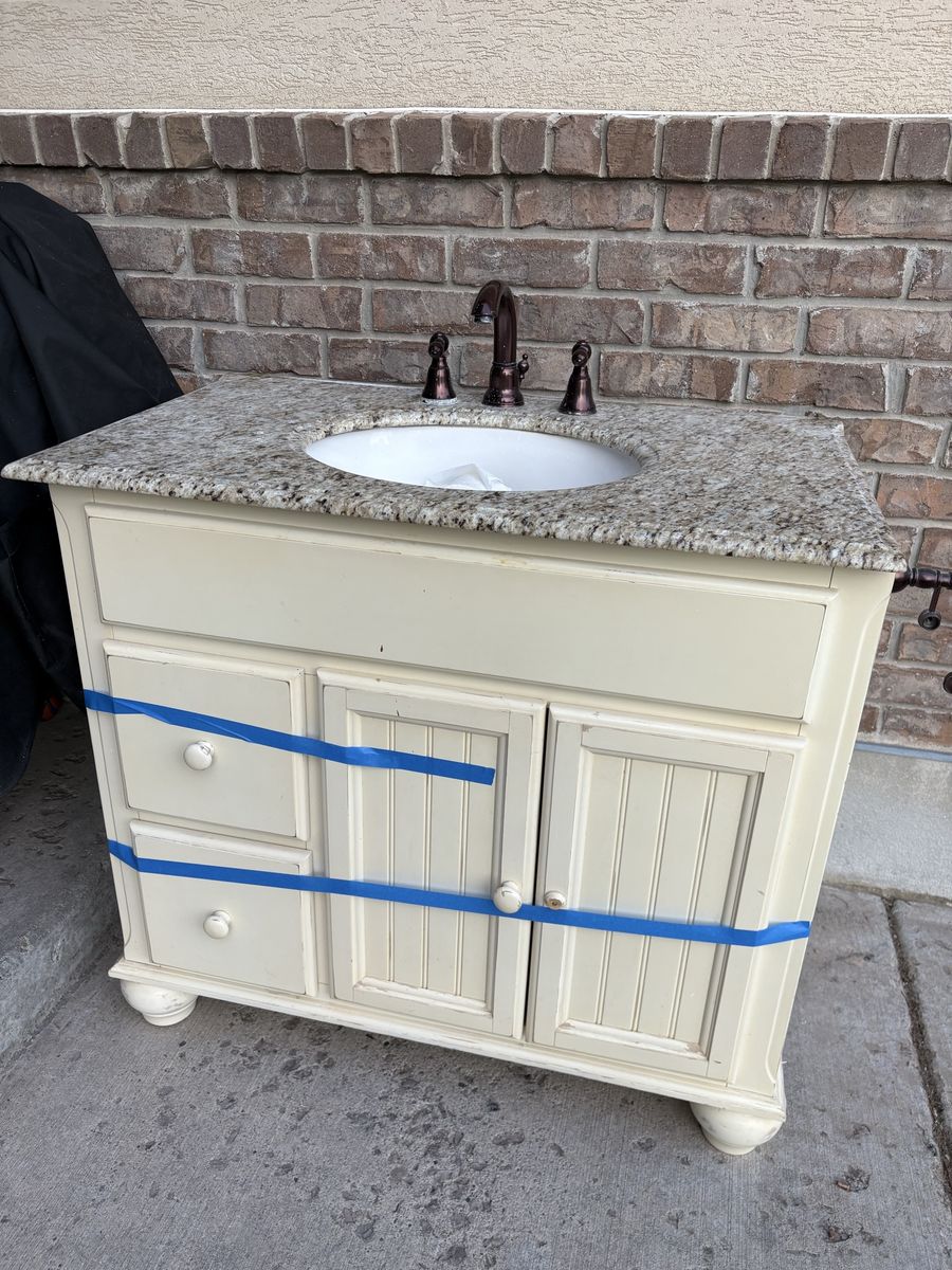 Cream Bathroom Vanity with Granite Countertop & Bronze Faucet - Single Sink
