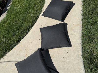 Set of 4 dark black toss pillows been in storage l