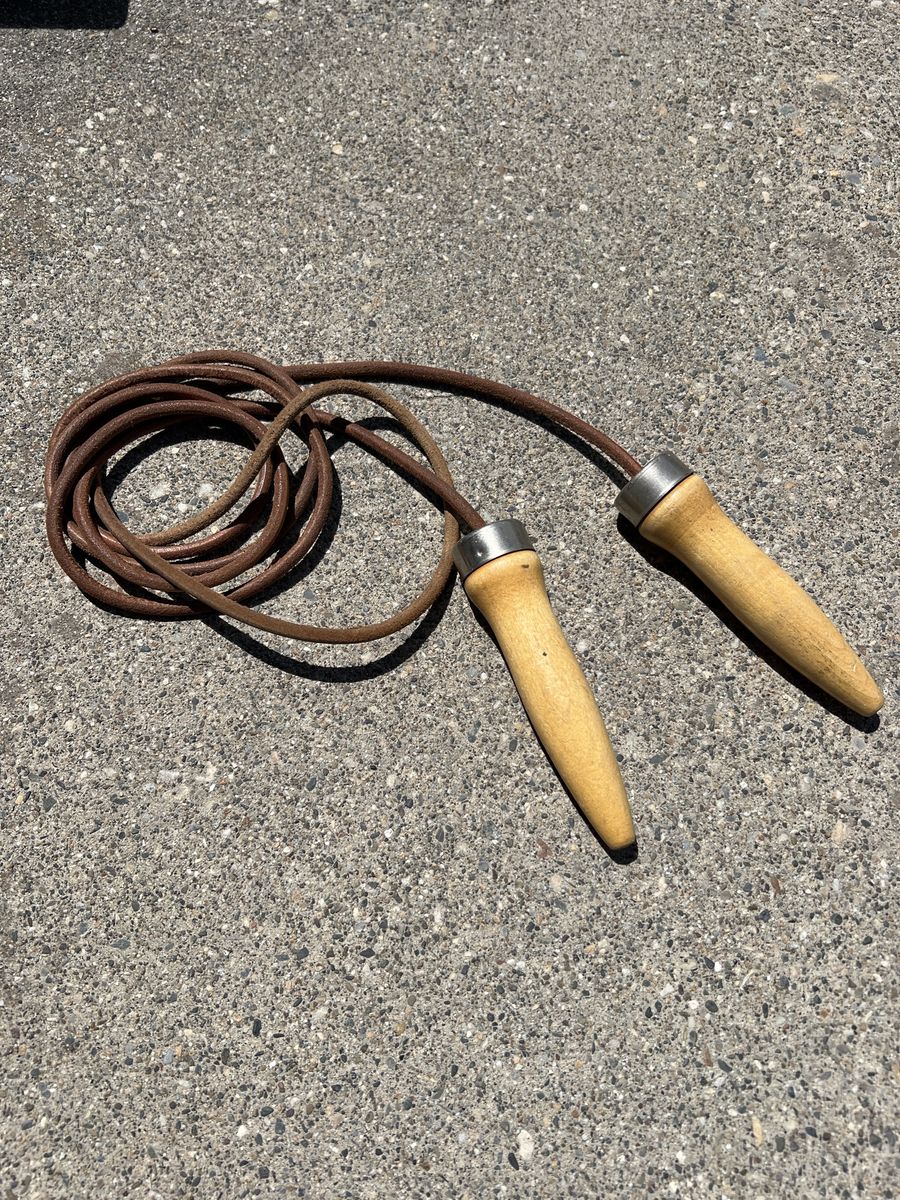 Vintage leather and ball-bearing wood handle jump rope