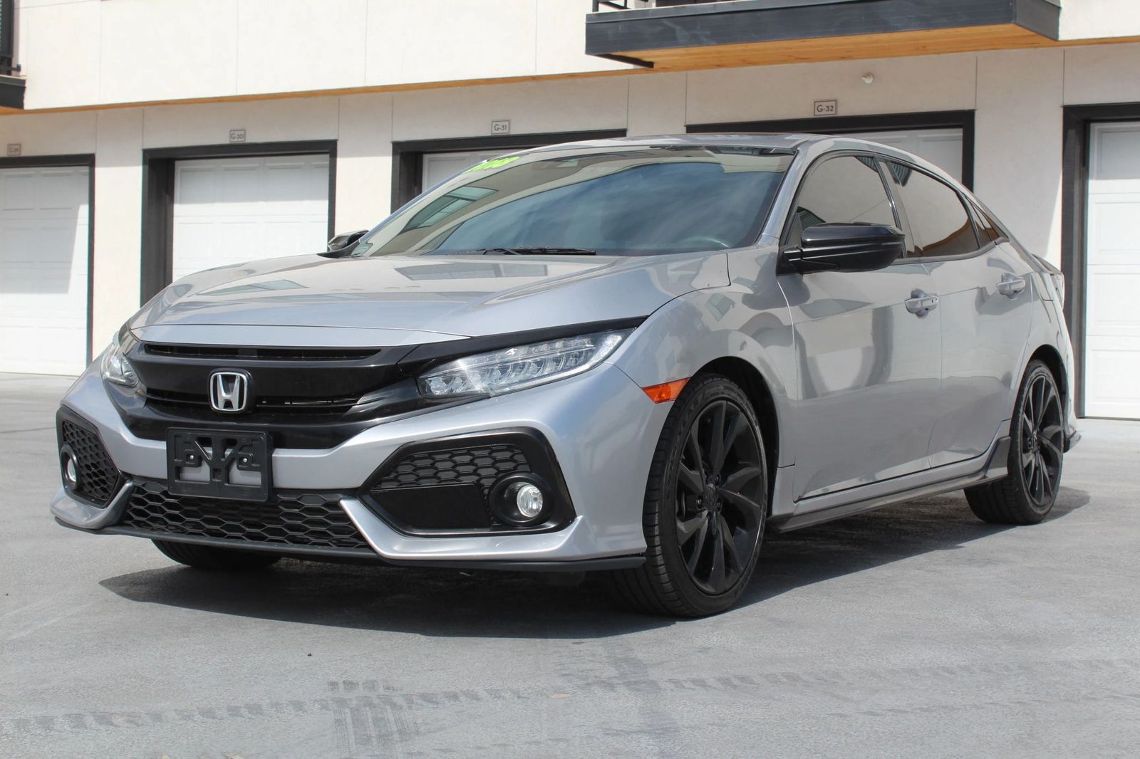 2018 Honda Civic Sport Touring — rebuilt & branded title, 16% below market