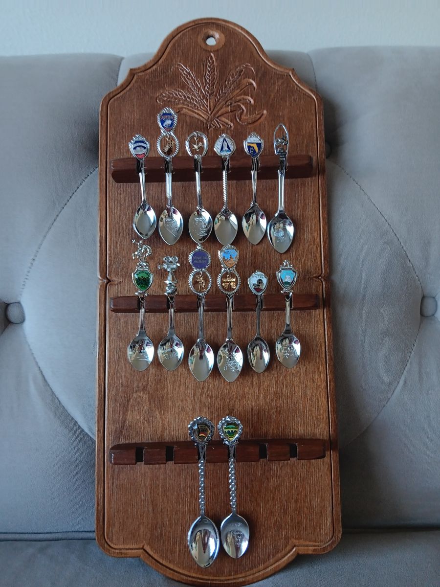 Vintage spoon collection rack with spoons