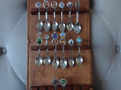 Vintage spoon collection rack with spoons