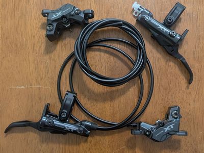 NEW Shimano XT M8220 Brakes w/ P03A Pads (Front & Rear)