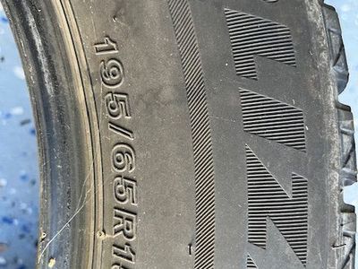 Free. One unmounted, winter Bridegestone Blizzak tire 195 65 R15