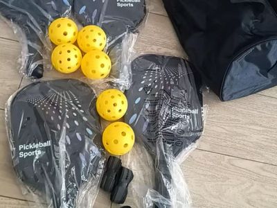 New in box pickleball of 4 Racquet