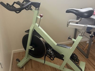 Star Trec Light Green Exercise Spin Bike with Adjustable Seat, Handlebars, and Pedals