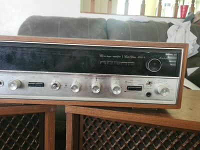 vintage sansui 5000x stereo receiver featuring a walnut wood cabinet