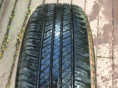 Bridgestone Tire (1) 265x70x17 and 17 “ rim included