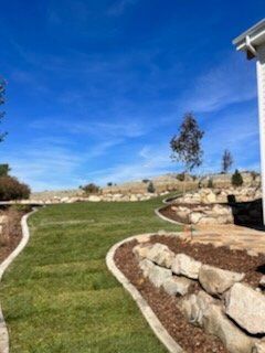 Landscaping Rock walls Stamped concrete Bolders