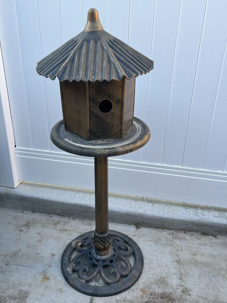 Cute birdhouse decoration that looks like cast iro