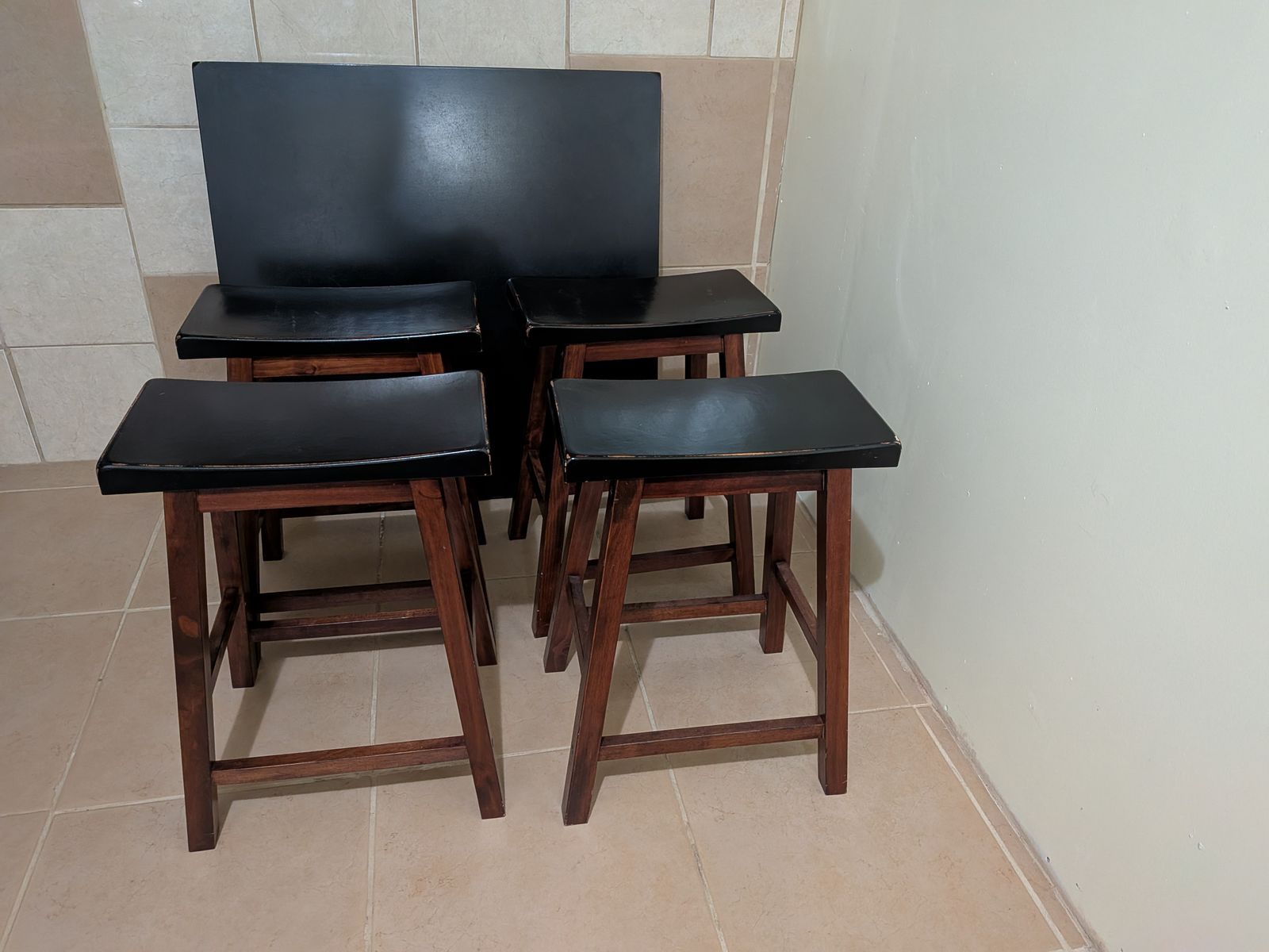 Square black table with four stools