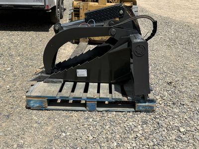 Root grapple for skid steer or track loader and machine that has a standard skid steer quick attach
