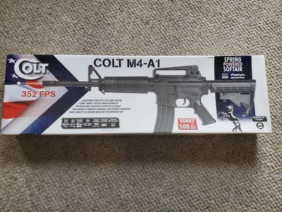 M4-style spring-powered airsoft gun