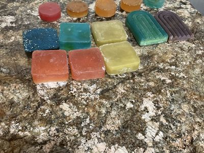 Handmade soap scented and colored, have lavender and rose leaves in them