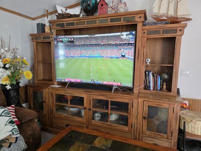 Entertainment center, TV, and coffee table