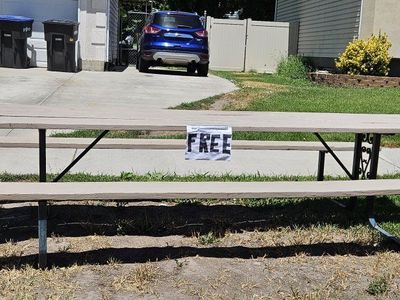 Sturdy Wooden Picnic Table with Metal Frame - Weathered, Functional Outdoor Seating