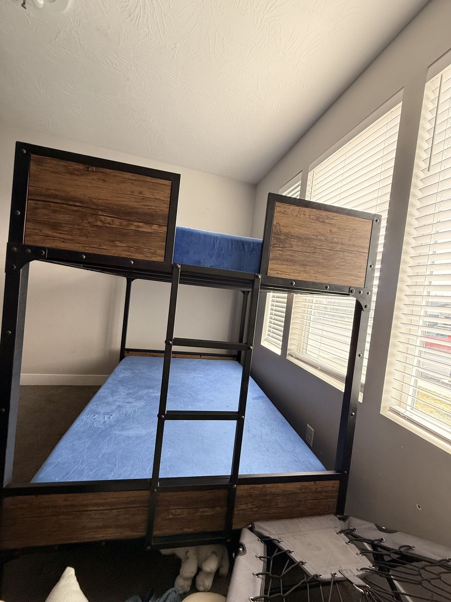 Metal bunk bed with wood panels