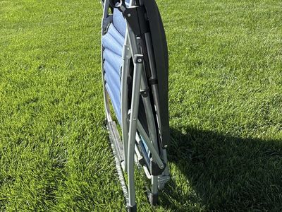 Blue Zero Gravity Folding Lounge Chair with Headrest. 35”x27” when folded