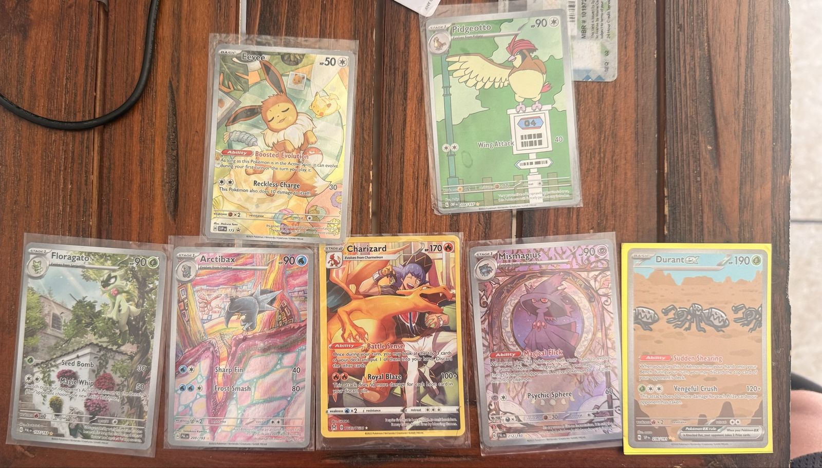 Pokémon TCG Card Lot: Eevee, Charizard, Mismagius, Durant ex, Floragato, Arctibax, Pidgeotto Holo/Rare Cards