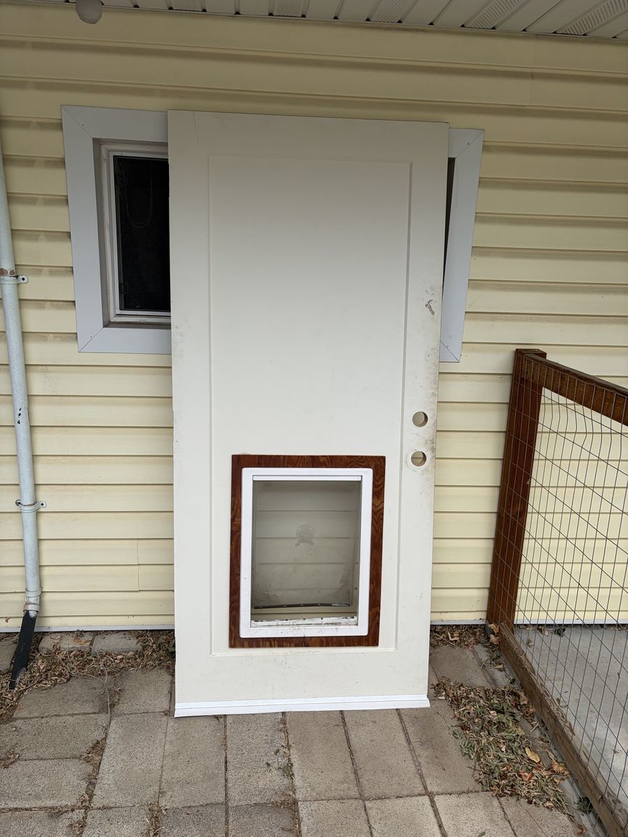 Door with dog door installed