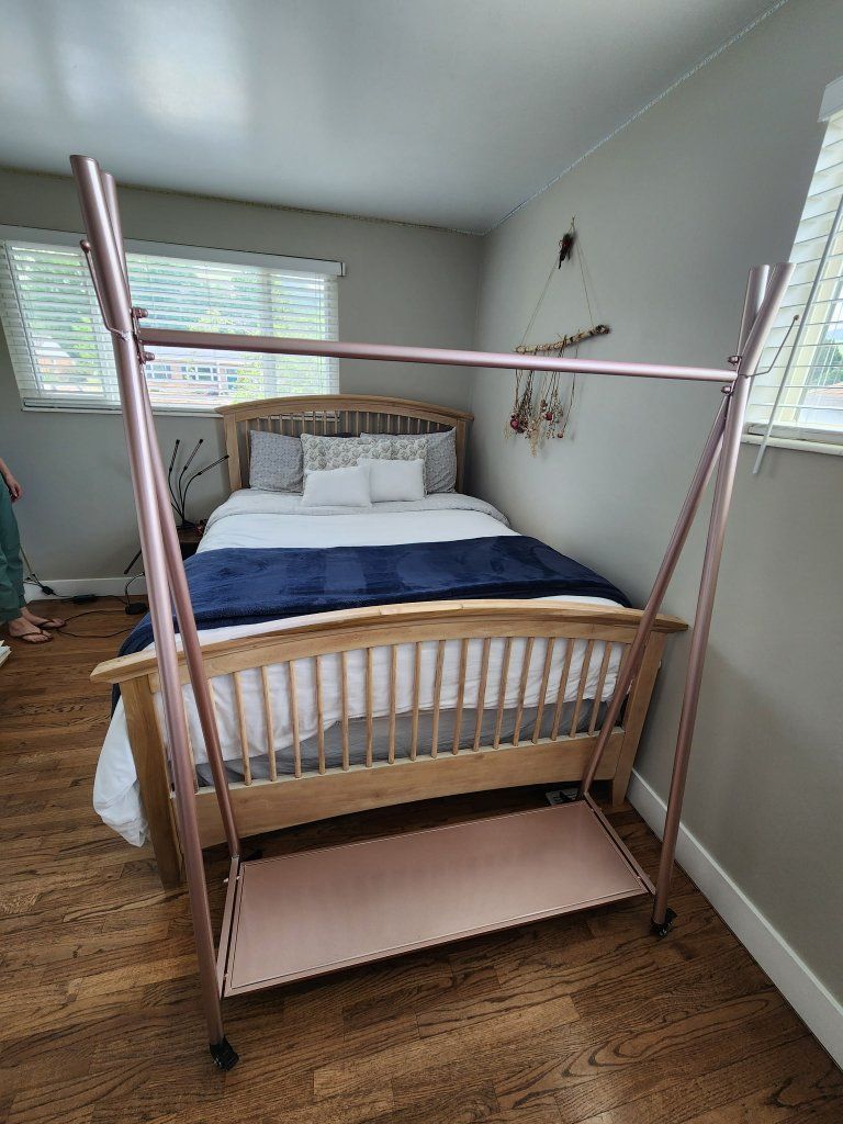Modern Rose Gold Metal Clothing Garment Rack with Bottom Shelf and Wheels