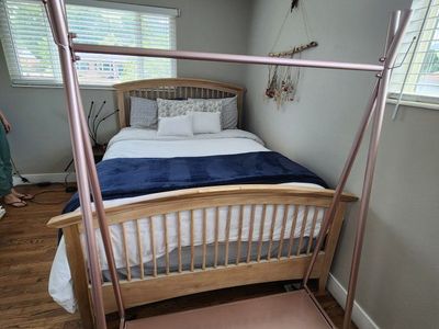 Modern Rose Gold Metal Clothing Garment Rack with Bottom Shelf and Wheels
