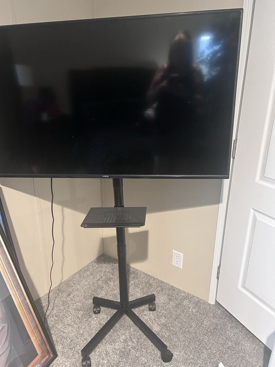 Vizio Smart TV Mounted on Rolling Mobile Stand with Shelf
