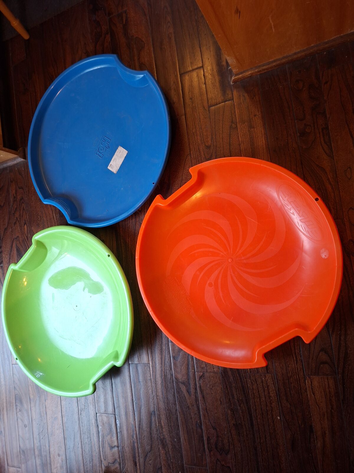 3 plastic sleds