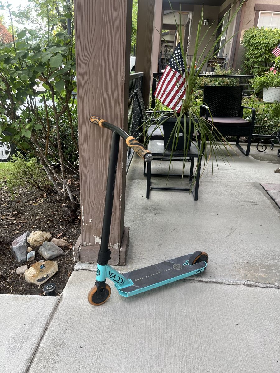 Madd Gear MGP Origin Pro Stunt Scooter - Teal/Black with Orange Wheels