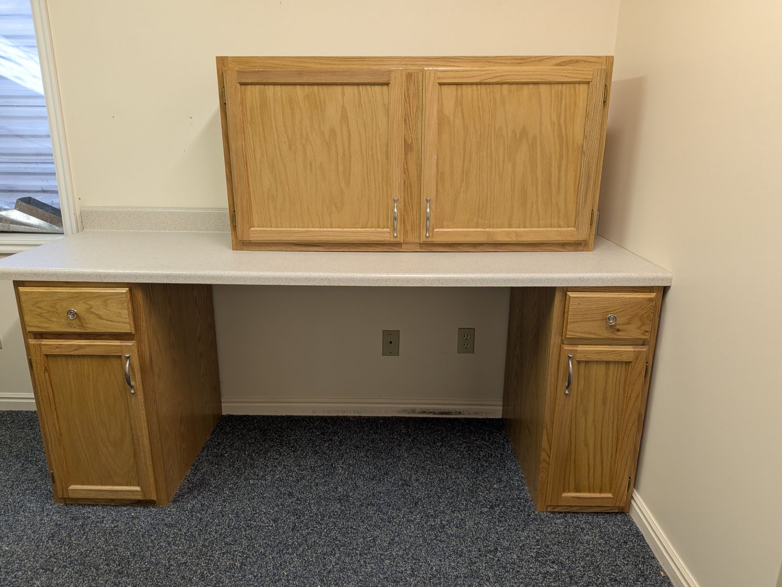 Counter top with three cabinets.  Sewing station or any work surface