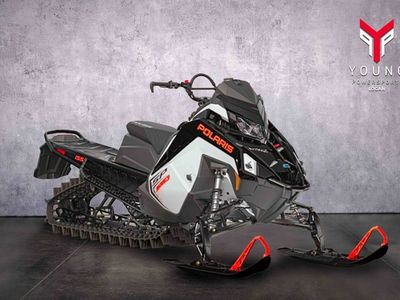 2027 Polaris® 650 RMK SP 155 ES White Lightning / Gloss Black / Orange Burst